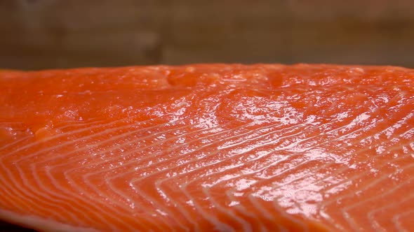 Close-up of Salt Strewed on Raw Salmon Fillet