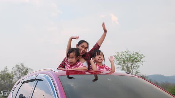 Happy family enjoying road trip on summer vacation.