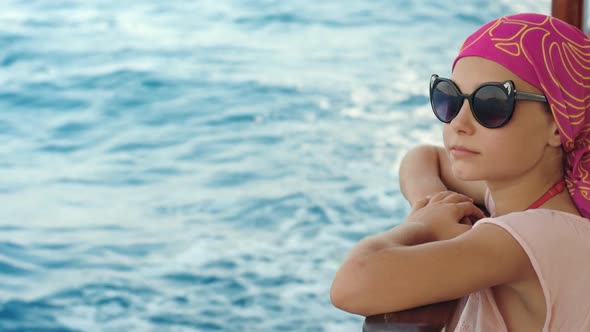 Fashion Girl Travel on Luxury Yacht at Summer Vacations. Girl Smiling at Boat