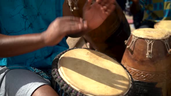 Drummers play at a festival in rural Ghana, West Africa as captured in slow motion.