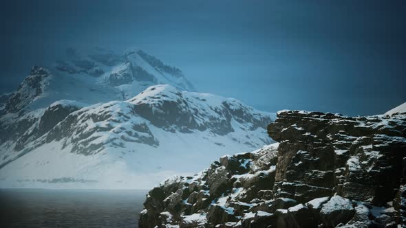 Snow Covered Mountains in Northern Ocean