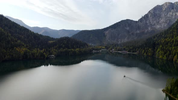 Aerial Shot of Beautiful Alpine Lake Ritsa Speed Boat Floating Summer, View From Above on Gorgeous