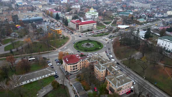  Aerial View of Roundabout Road with Circular Cars in Small European City at Cloudy Autumn Day