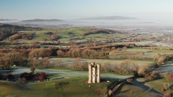 Aerial drone video of Broadway Tower, a famous iconic tourist attraction in The Cotswolds Hills, ico