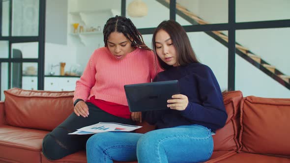 Multinational Females Discussing New Startup Indoors