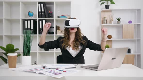 Businesswoman Working on Imaginary Screen Using Augmented Reality Glasses