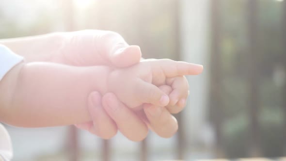 Hand Mom With Newborn Baby