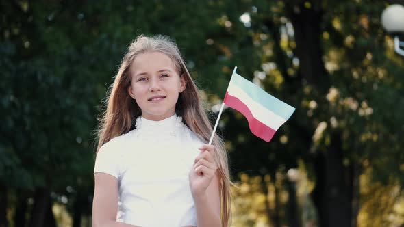 Portrait of Girl with Closed Eyes Holding Luxembourg Flag