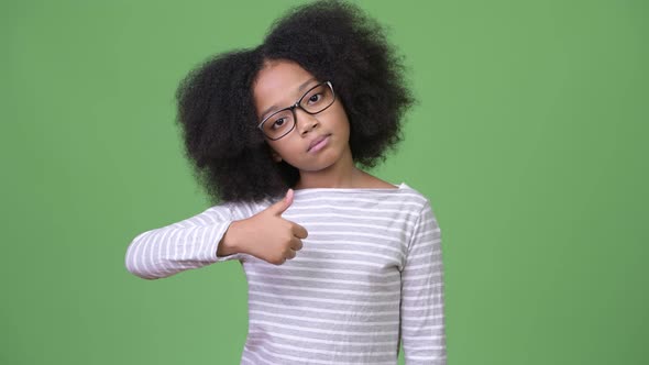 Young Tired African Girl with Afro Hair Giving Thumbs Up