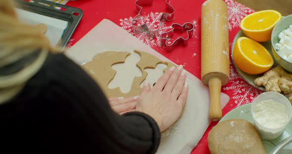 Cutting Out Gingerbread Cookies From Dough in Kitchen, Medium.