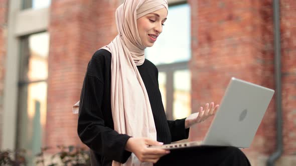 Elegant Tall Slim and Wearing Black Clothes and Turban Smiling While Working During Break