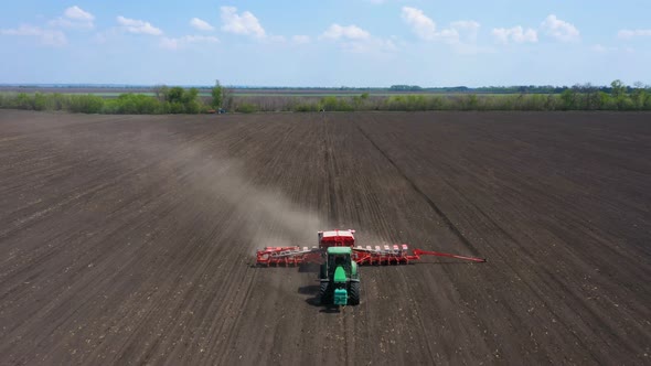 Working At The Field Tractor With The Seeder 4