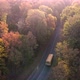 Road with school bus in beautiful autumn forest at sunset - VideoHive Item for Sale
