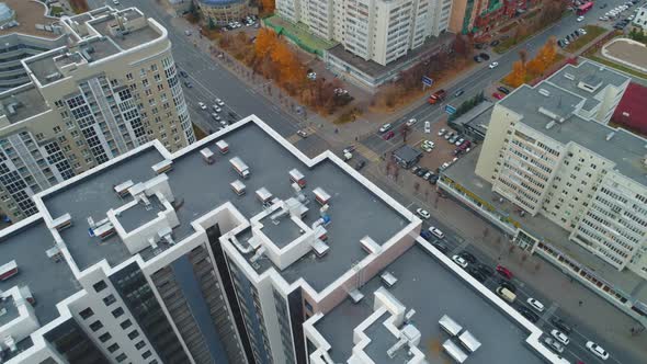 Busy Crossroad in City District with Multistory Buildings