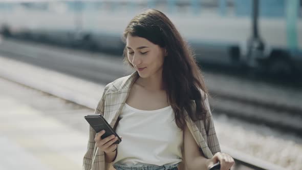 Close Look Portrait of Beautiful Businesslady Waiting for a Train on Railroad Station