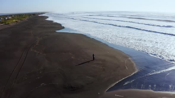 Silhouette of a Man on Khalaktyr Beach in Front of the Pacific Ocean