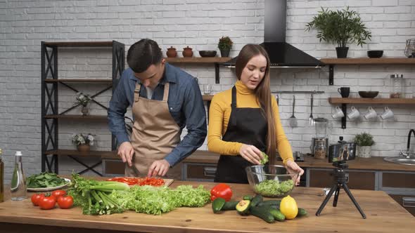 Food Blogging Young Woman Talking About Salad Preparing Process and Filming the Whole Process with a