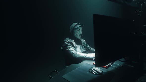 Anonymous Man Committing Cybercrime