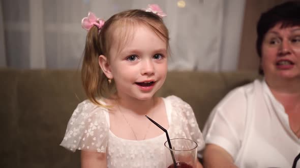 A Little Girl Tells a Poem and Her Grandmother Helps Her Remember the Words