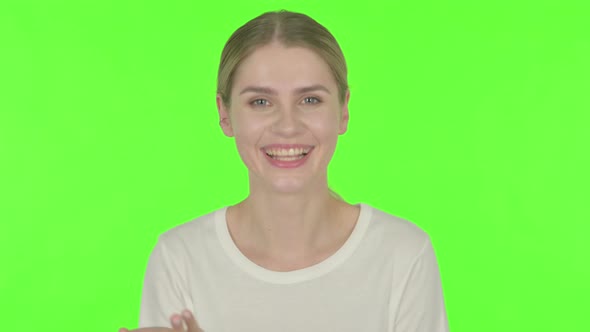 Online Video Chat by Happy Young Woman on Green Background