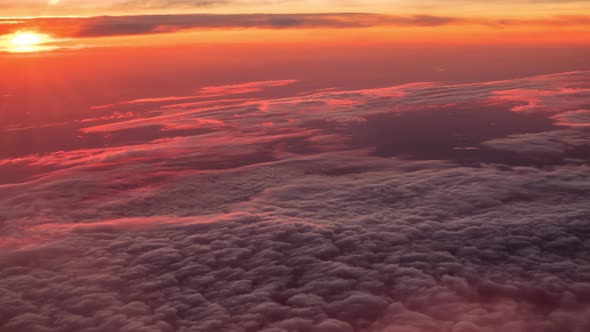 Flight Above Pink Clouds During Sunset