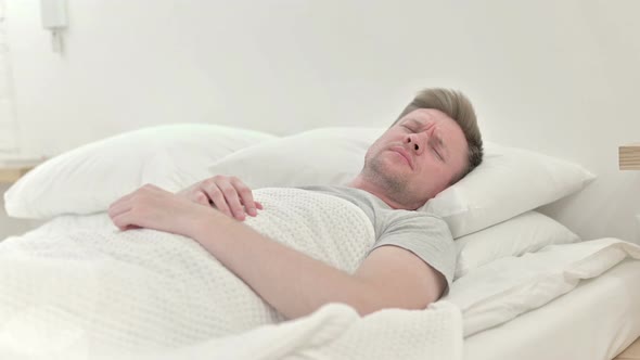 Long Shot of Man Waking Up From Nightmare