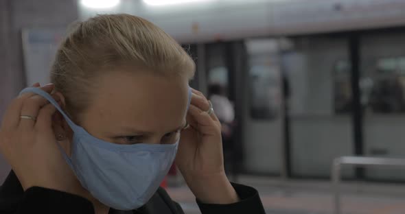 In Hong Kong, China in Subway a Young Girl Wears a Medical Mask