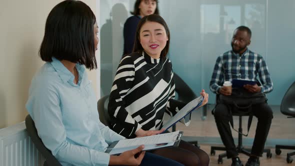 Diverse Group of Women Having Conversation in Waiting Lobby