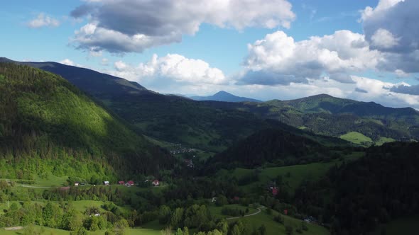View From a Bird's Eye View Mountainous Landscape in the Countryside with Forests and Green Meadows