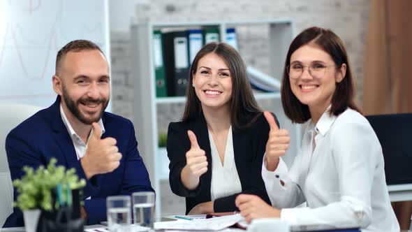 Happy Businessman and Businesswoman Smiling Showing Cool Thumb Up Enjoying Corporate Meeting