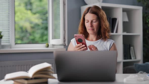 Woman Using Smartphone at Home