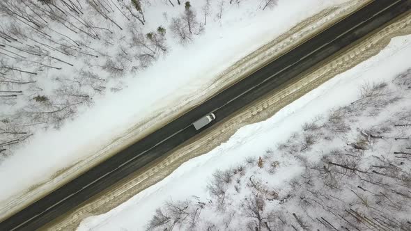 Cars And Truck On Winter Forest Road From Above