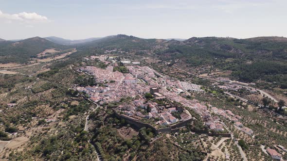 Medieval fortified Castle of Castelo de Vide overlooking charming town, Portugal. Aerial