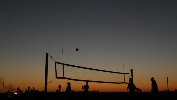 Volleyball Net Silhouette on Beach Court at Sunset Players on California Coast