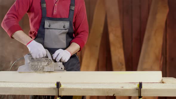 Close-up of Work with an Electric Planer. Polishing of Wooden Products