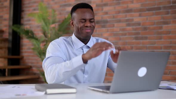 Upset Frustrated African American Man Office Worker Top Manager Uses Laptop Holding Hands on Head