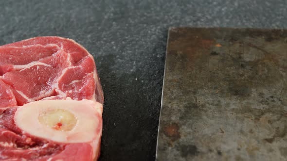 Meat chop and cleaver on the board