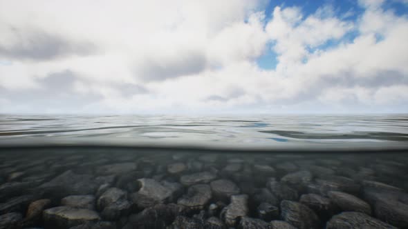 Ocean Seascape with Sky and Ocean Wave Splitted By Waterline to Underwater Part