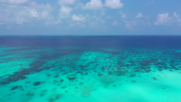 Aerial top down travel of marine lagoon beach journey by transparent lagoon with clean sandy backgro