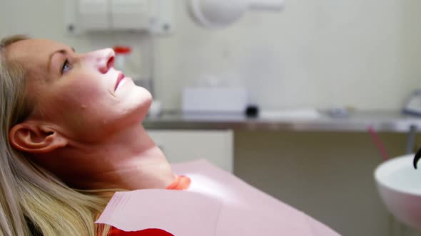 Woman relaxing on dentist chair