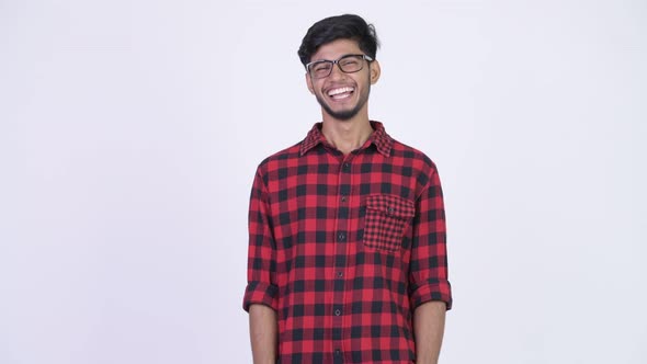 Young Happy Bearded Indian Hipster Man Laughing