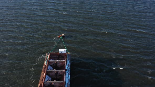 An aerial view over Hempstead Bay during a windy, winter day. The drone camera dolly in, tilt down a