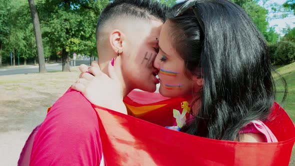 Lesbian couple kissing in public park