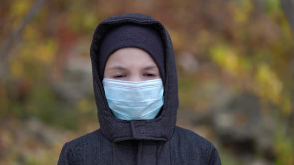 Boy in Medical Mask on the Street