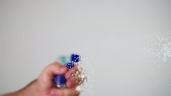 Cleaning Glass Using Spray Detergent on Grey Chroma Key Background