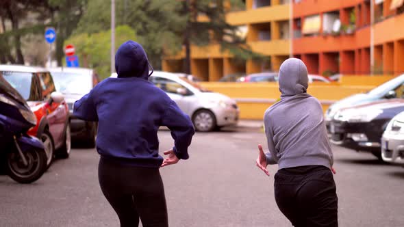 street dance - synchronized ballet of two girls in the hip hop style