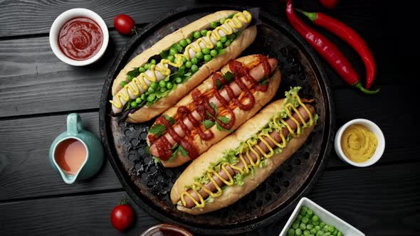 Vegeterian Hot Dogs Served with Tomatoes Avacado Onion and Buns Over Wooden Background