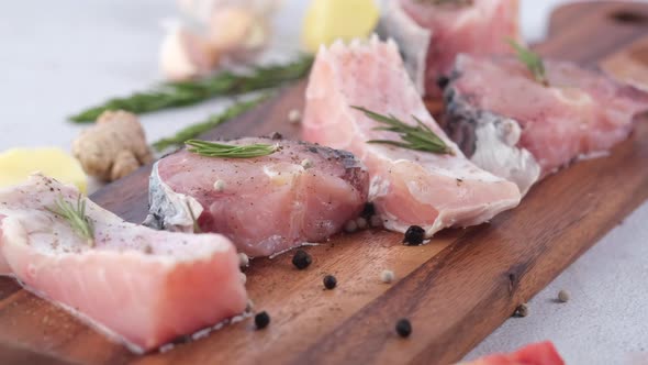 Raw Fresh Fish on a Chopping Board for Preparing for Cooking on Table