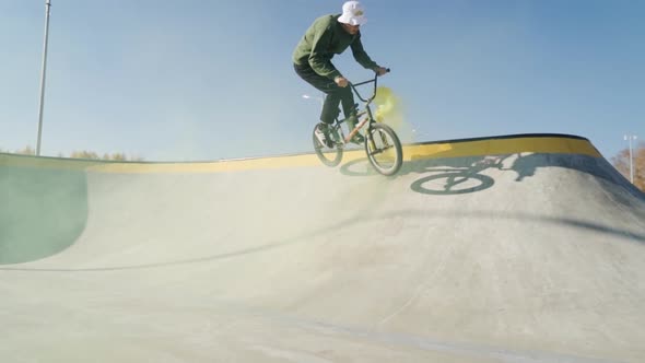 Man Riding Bmx Bicycle on Bowl at City Skate Park