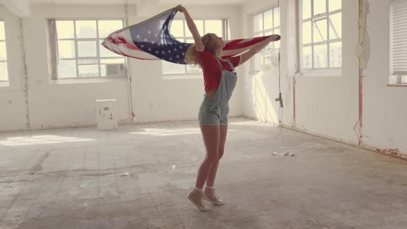 Fashionable young woman in an abandoned warehouse